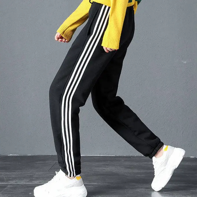 Jogging polaire femme noir avec bandes blanches doublé en laine